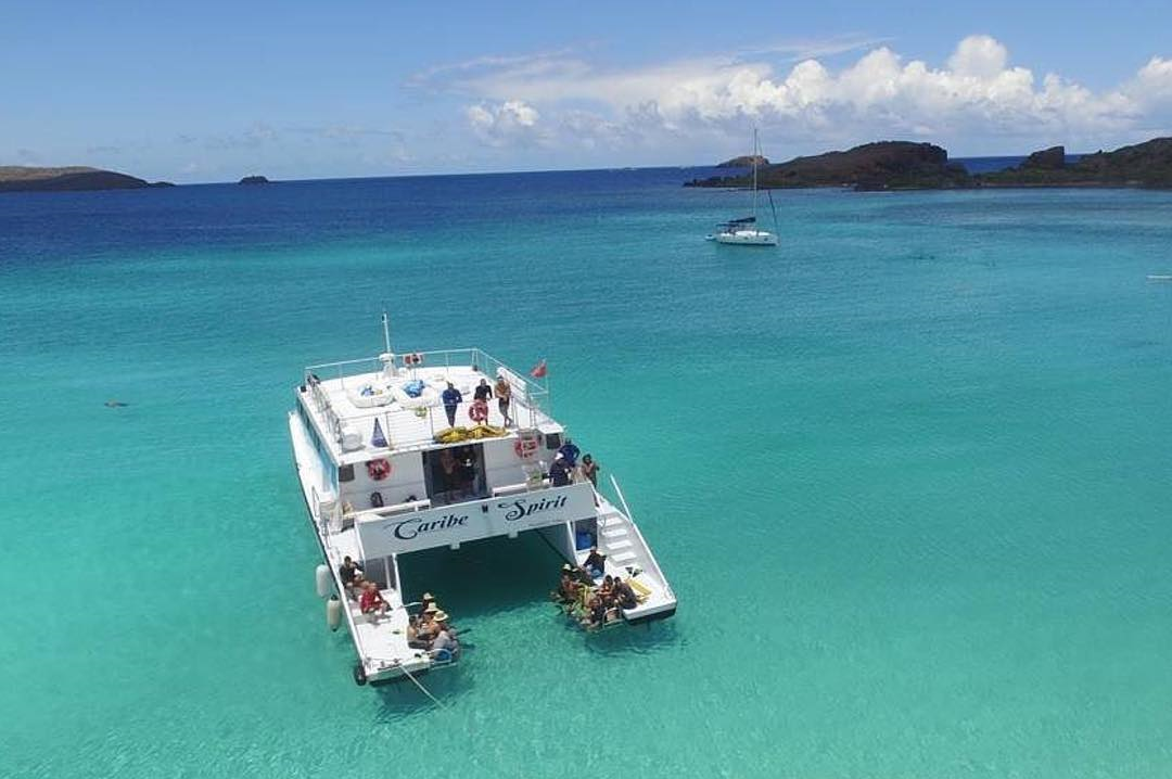 Private yacht with guests relaxing on the sundeck, Puerto del Rey Marina Fajardo